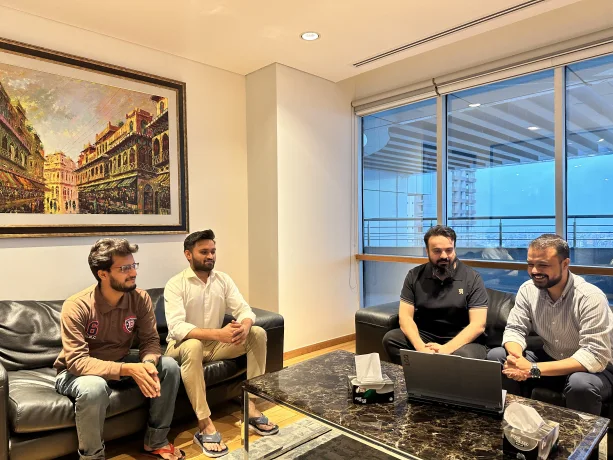 Providus team members working in the office lounge
